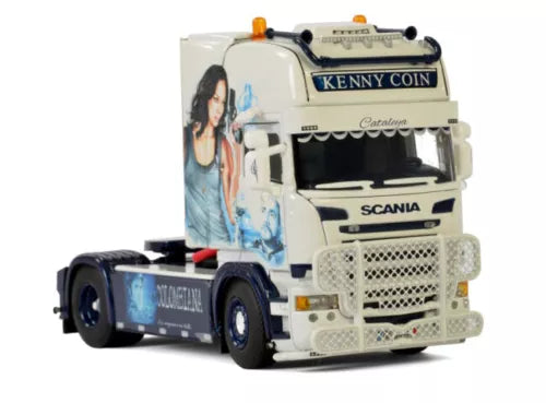 Diecast model truck with white cab and blue graphics, front grille and headlights