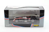 1:43 diecast race car model in clear box, black with red and white accents, ONYX