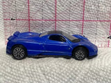 Blue sports car diecast model, side profile with black wheels