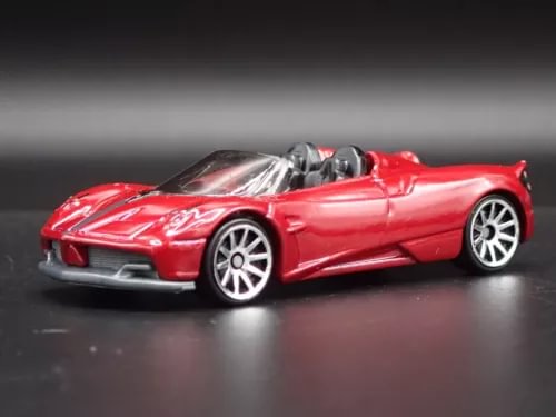 Red 1:64 scale roadster diecast model car with silver hood stripes and raised wheels