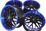 Diecast car wheel set with four black multi-spoke rims and blue ring edges
