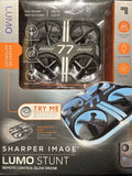 LED glow stunt drone with blue and black body, shown on remote-control box