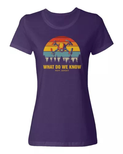 Ladies crewneck T-shirt, purple, front drone graphic, What Do We Know text