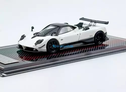 White racing sports diecast model car with large rear wing and black wheels