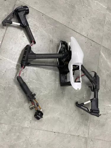 DJI Inspire 1 drone body frame with arms and motors, white and dark gray
