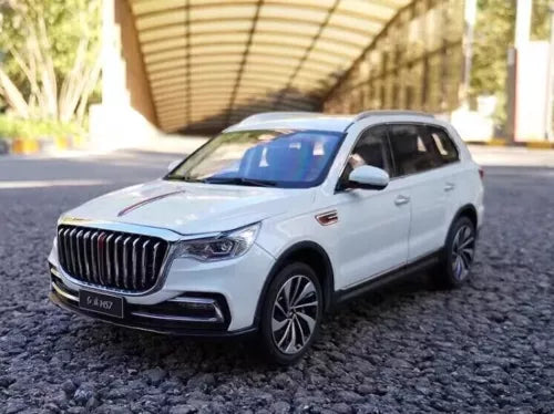 White die-cast off-road SUV model with front grille and headlights