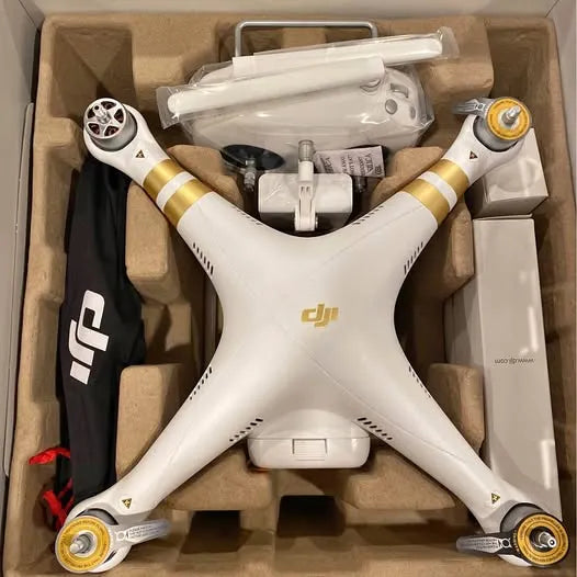White DJI Phantom 3 Pro quadcopter drone with propellers and landing gear