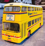Yellow diecast city bus model with red stripe, front 3/4 view.