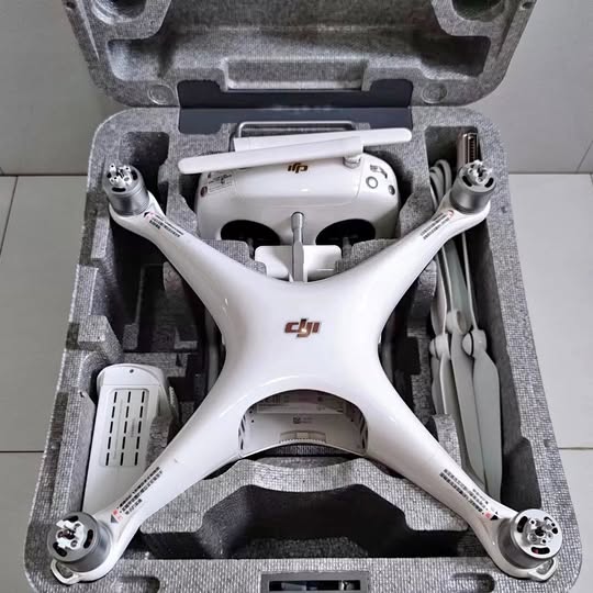 White DJI Phantom 4 Pro V2.0 drone with arms extended in protective case