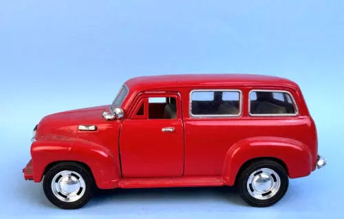 Red vintage Chevrolet Suburban diecast model toy car, side view