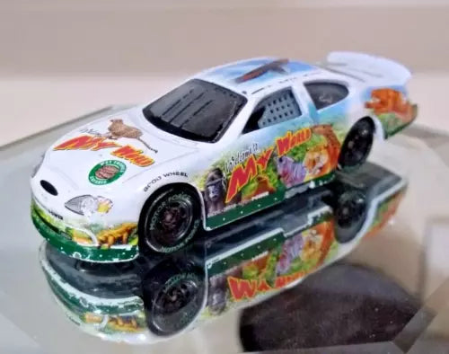 White 1:64 diecast race car with multicolor tropical livery and open wheel details