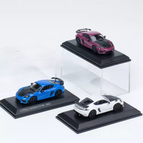 Diecast model car toy set with blue, white, and pink sports cars on display stands