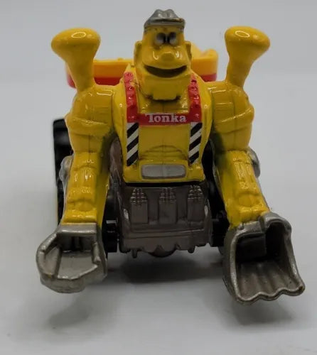 Yellow diecast truckbot with open hands, black chest panel and red accents