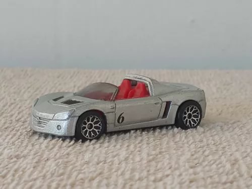 Silver diecast convertible car with red interior, front 3/4 view, number 6