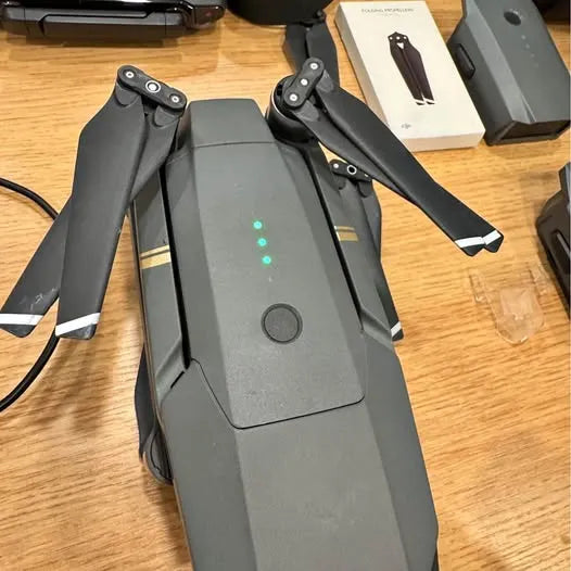 DJI Mavic Pro drone with folded prop arms, dark gray