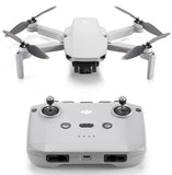 DJI Mini 2 SE drone with white quadcopter body and folded propellers, top and control view