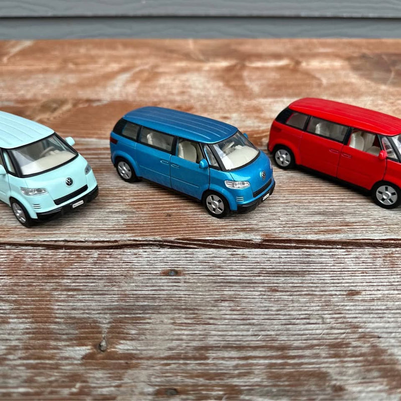 Diecast toy Microbus van cars in blue, red, and light blue, three-quarter views.