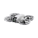 Portable mini drone with four propellers and protective prop guards, light gray