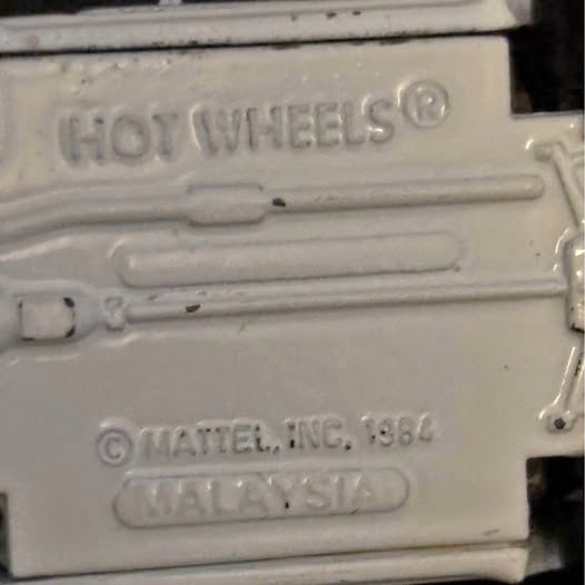 Hot Wheels diecast card back with logo and © Mattel 1984 text