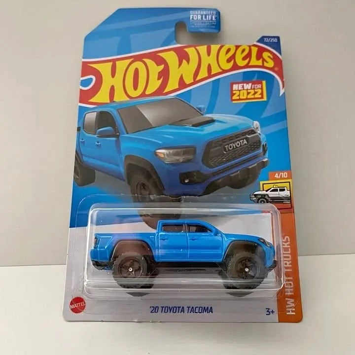 Blue 2020 Toyota Tacoma Hot Wheels diecast truck in clear blister package