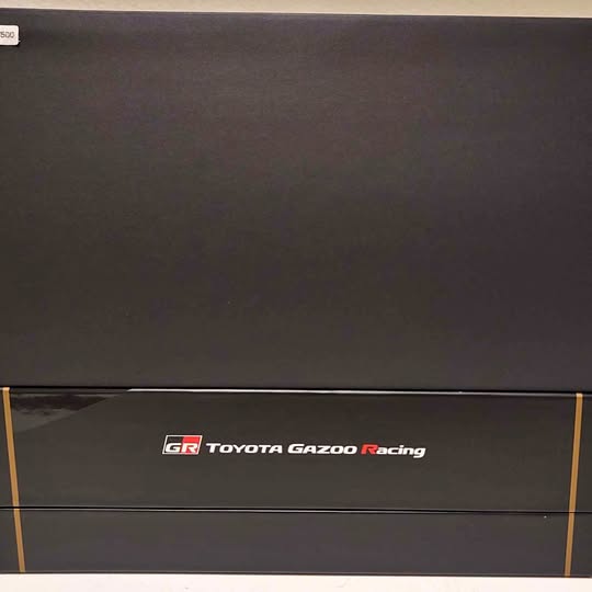 Diecast box lid with Toyota Gazoo Racing GR logo and gold trim