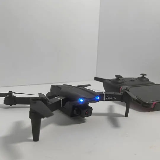 Black camera drone with front camera and blue LEDs, 4 propellers