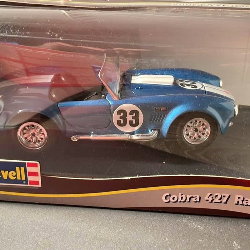 Blue diecast racing car model with #33 on door and silver wheels
