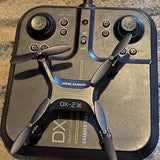 Stunt drone controller with two joysticks, power switch, and indicator lights