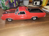Red 1970 Chevrolet El Camino SS diecast model car with open bed, front three-quarter view.