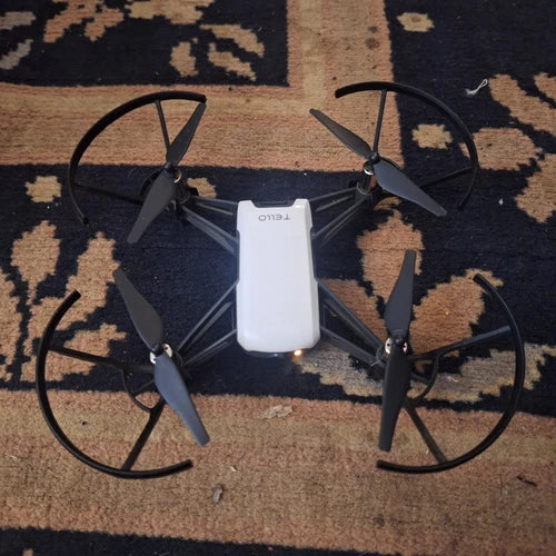 DJI Tello RC drone with white body and four black propellers