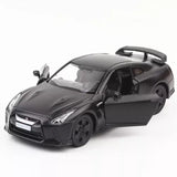 Metal diecast pull-back toy car, Nissan GTR style, dark gray coupe with black wheels
