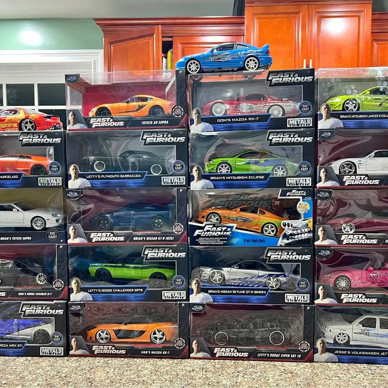 Diecast race car models in retail boxes, assorted colors and graphics