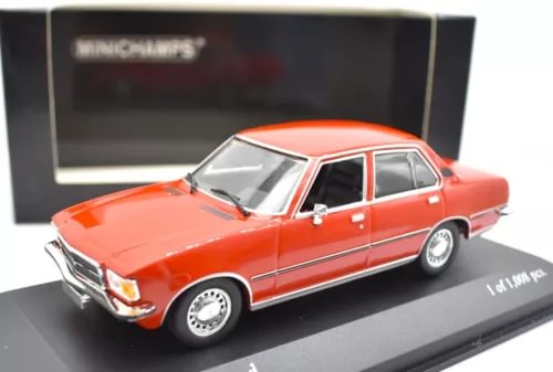 Orange die-cast sedan model with chrome grille and white wheels