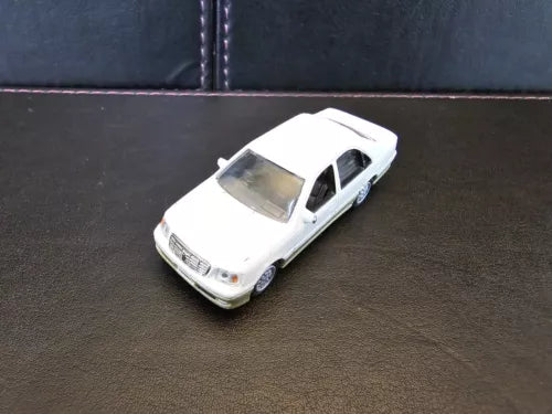 White diecast toy car, front three-quarter view