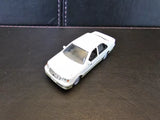 White diecast toy car, front three-quarter view