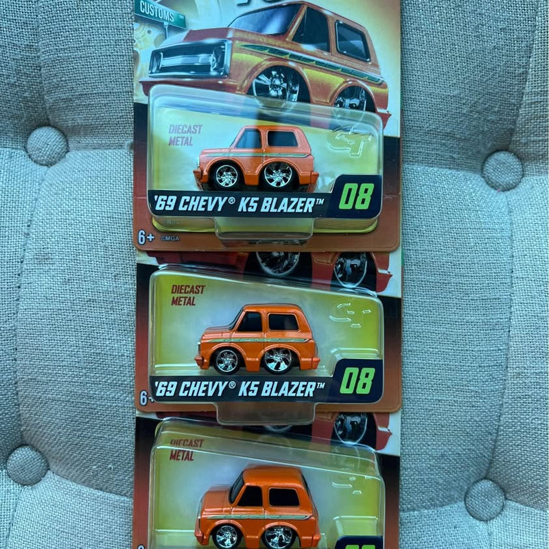 Diecast car blister pack set with three orange 69 Chevy models, #08