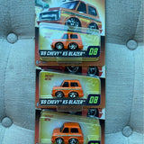 Diecast car blister pack set with three orange 69 Chevy models, #08