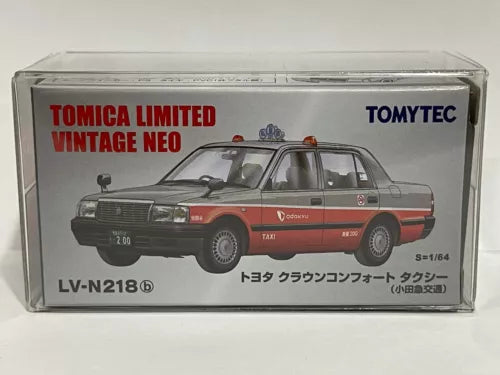 Toy car model in clear box, red and black sedan with roof sign and taxi decals