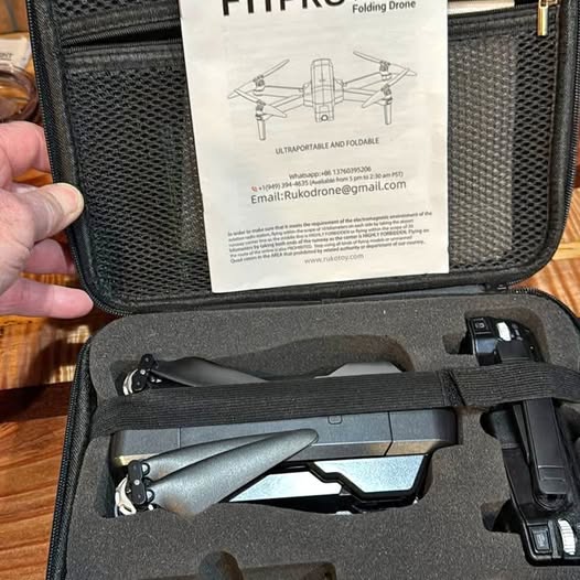 Folding drone in carrying case with remote and foam insert