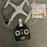 Drone controller, black with white buttons and dual joysticks
