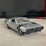 Silver diecast car model with black hood stripes and front grille detail