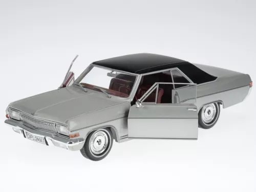 Silver diecast coupe model car with open door, front and side view
