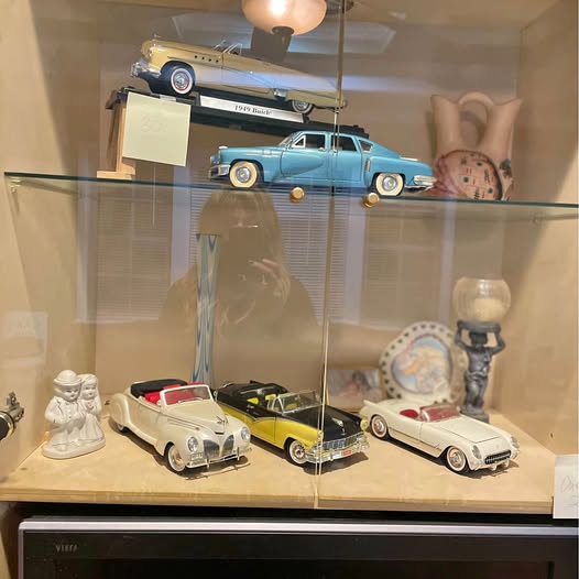 Diecast classic car set in glass display case with blue, cream, and white cars