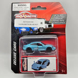 Blue die-cast toy car (Porsche Taycan Turbo S) in blister packaging