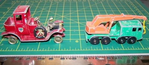 Red diecast crane truck and orange-and-teal diecast crane vehicle, 2-piece side view