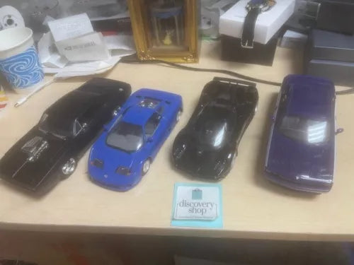 1/24 scale toy car set, four diecast cars in blue, black, and purple