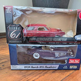 Two die-cast model cars in boxes: red Studebaker and dark Horch 855 Roadster