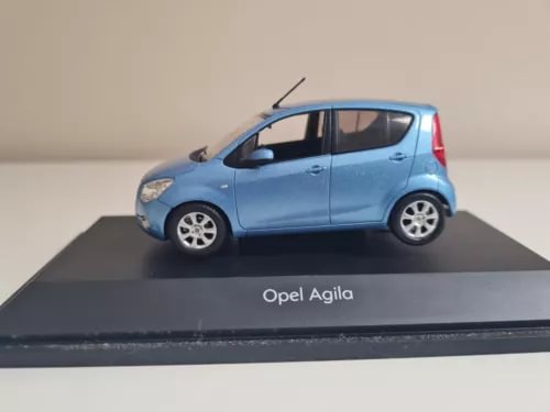 Blue diecast model car, side view, detailed wheels and doors