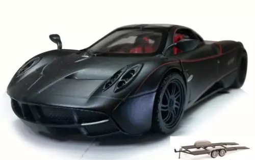 Dark gray diecast sports car with front grille and small trailer