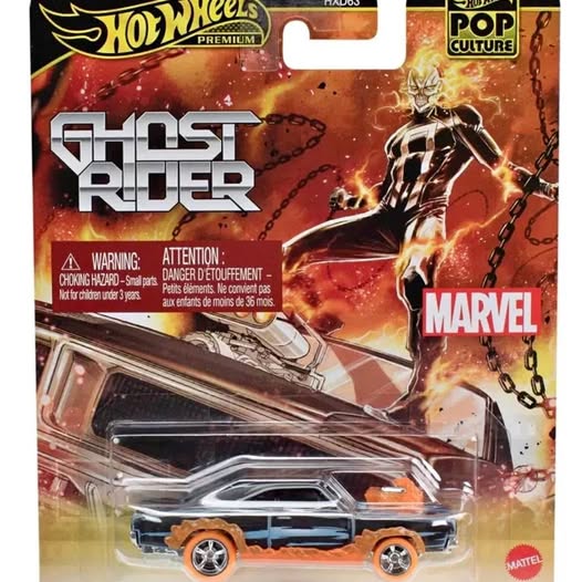 Orange and blue Hot Wheels diecast car on premium blister pack, Ghost Rider theme.